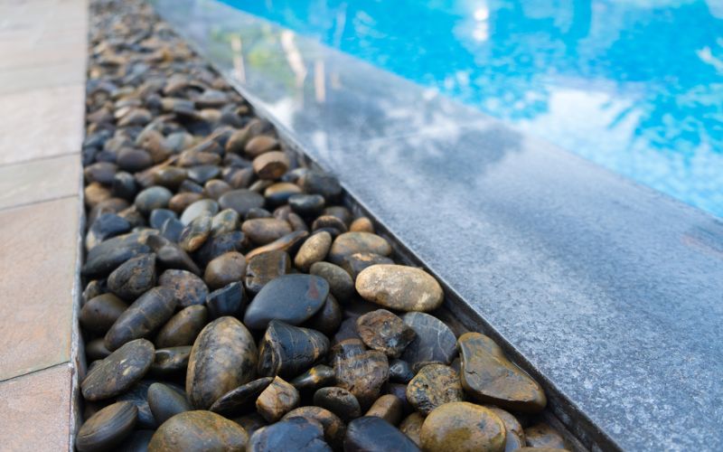 Aggregates used around pool decking for natural transition to landscape
