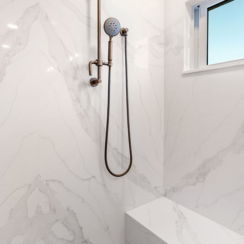 Close-up of Vadara quartz shower surface.