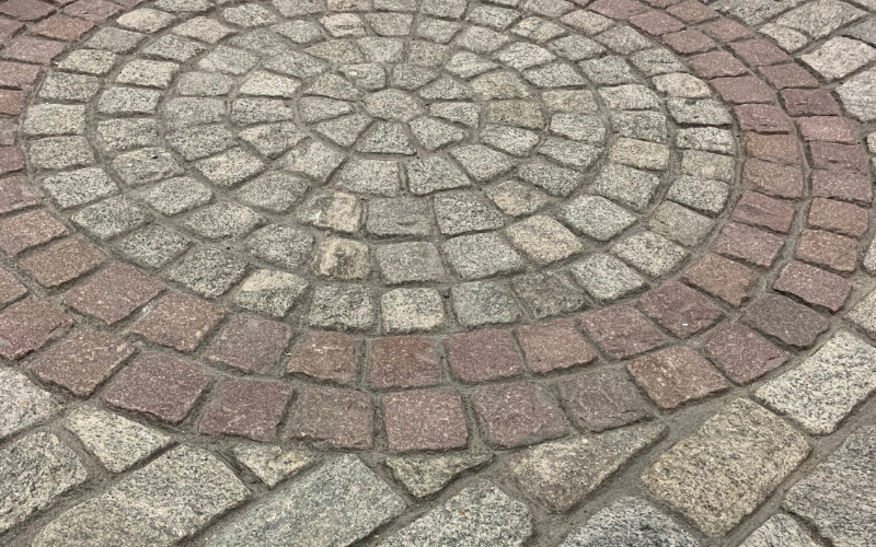 Circular pattern cobblestone patio.